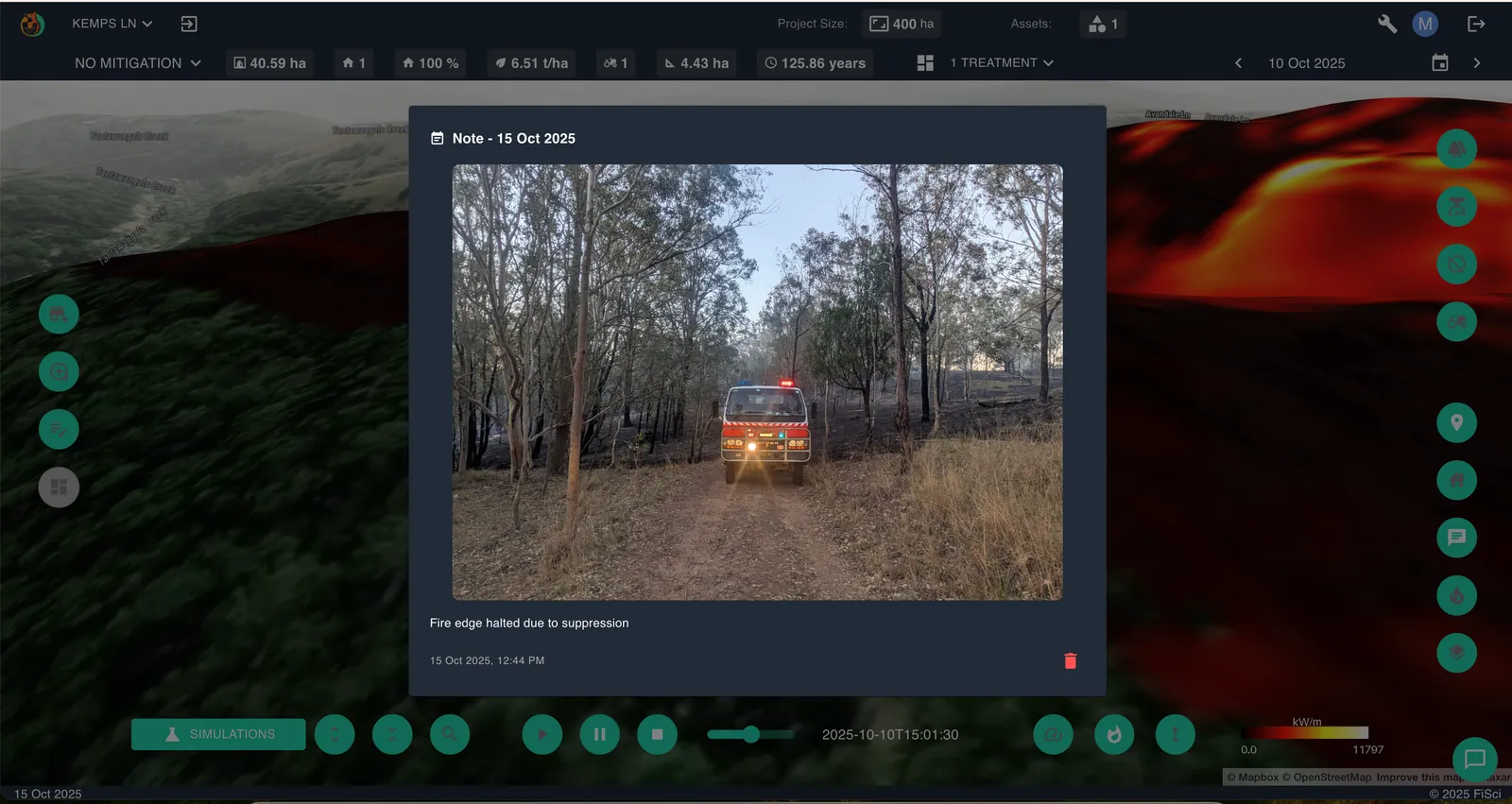 Field photograph logged within the Mitigate platform showing a fire appliance on a bush track beside a contained fire edge.